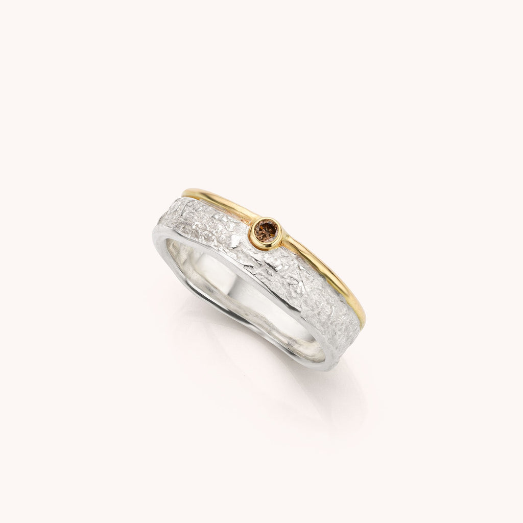 zilverenring met geelgouden rand en bruine diamant