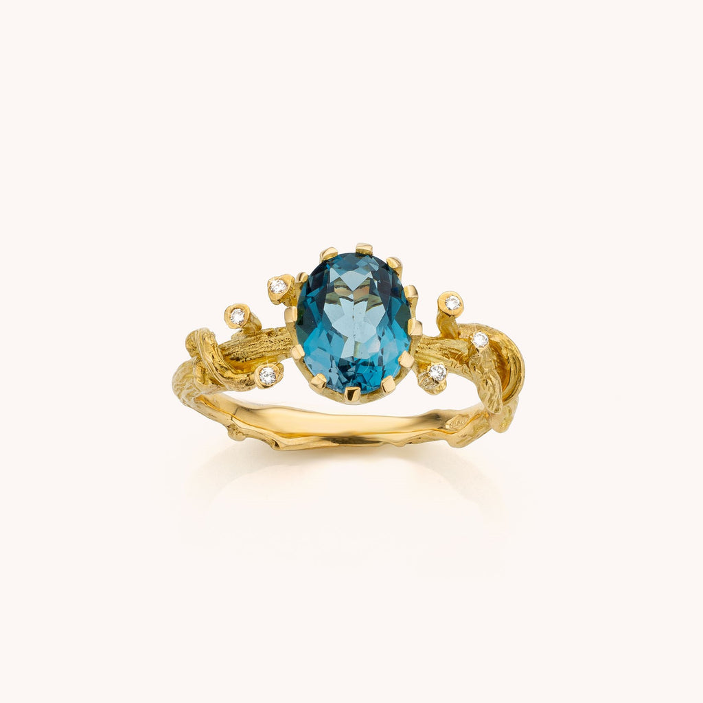 geelgouden ring met topaas en diamant